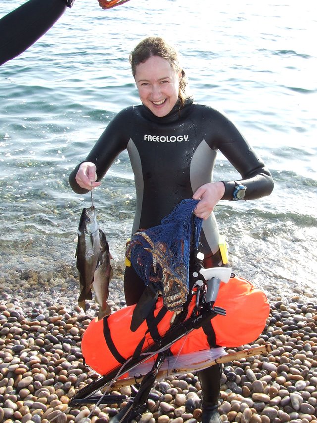 Spearfishing Courses, Emma Farrell with fish, crab and spearfishing gear